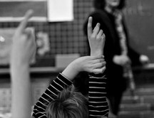 STDK. Boy raises hand for question